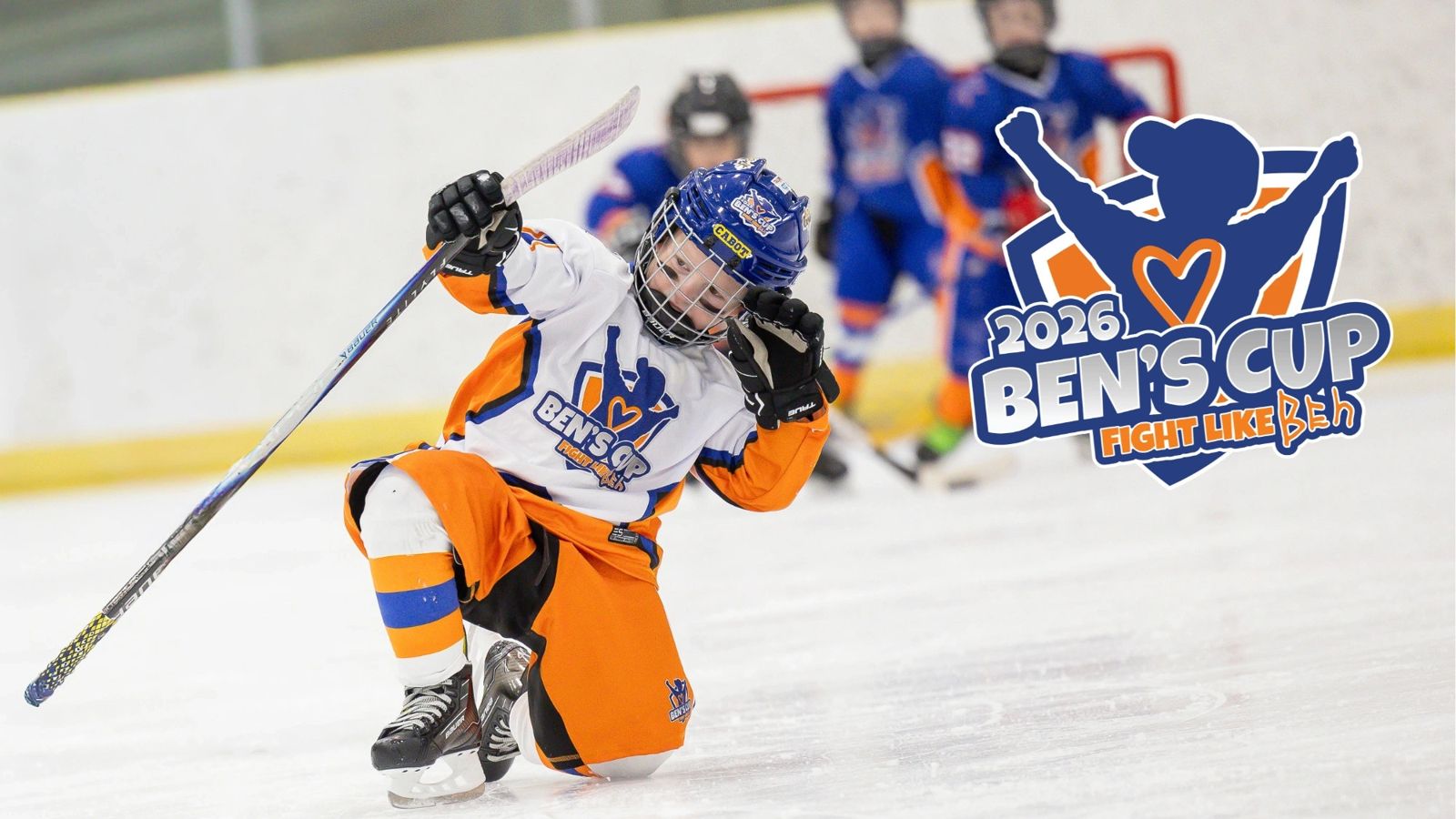 A young Ben's Cup player celebrating on the ice